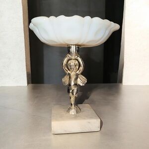 Vintage milk glass vanity dish with a cherub stand and marble base